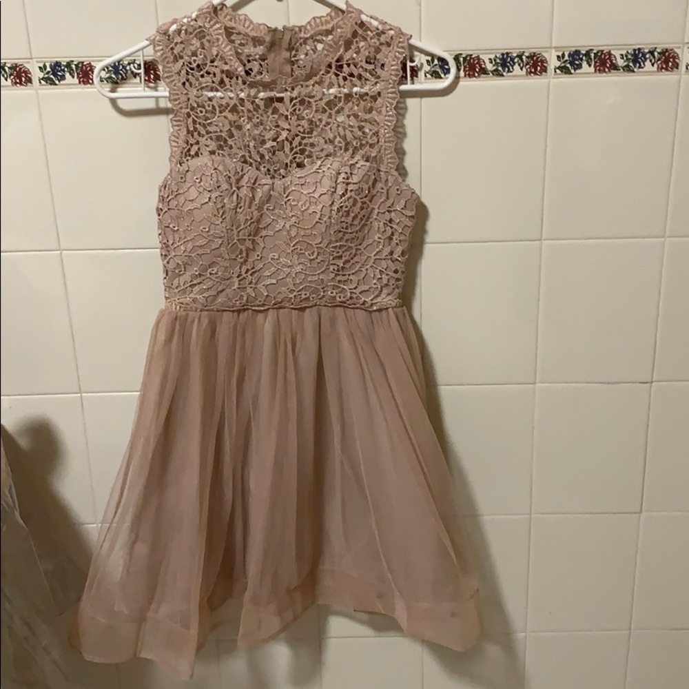 Soft pink, embroidered top with flare tulle
